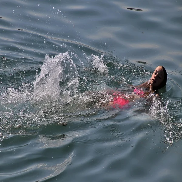 Girl swimming in lake